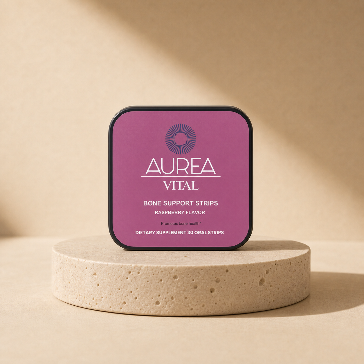 Aurea Vital Bone Support Strips tin on a warm travertine pedestal.